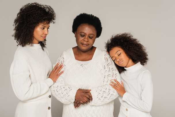 sad african american daughter, mother and granny standing isolated on grey - Fotoğraf, Görsel