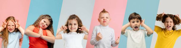 Art collage made of portraits of little and happy kids isolated on multicolored studio background. Human emotions, facial expression concept - Фото, зображення