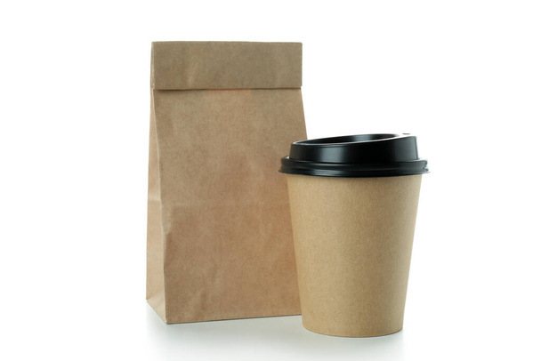Paper cup and paper bag isolated on white background - Foto, Bild