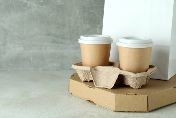 Delivery containers for takeaway food on white textured table - 写真・画像