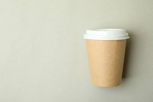 Blank paper cup on light gray background, space for text - Fotoğraf, Görsel