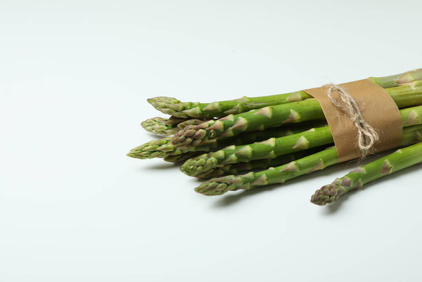 Fresh green asparagus on white background, space for text - Foto, afbeelding