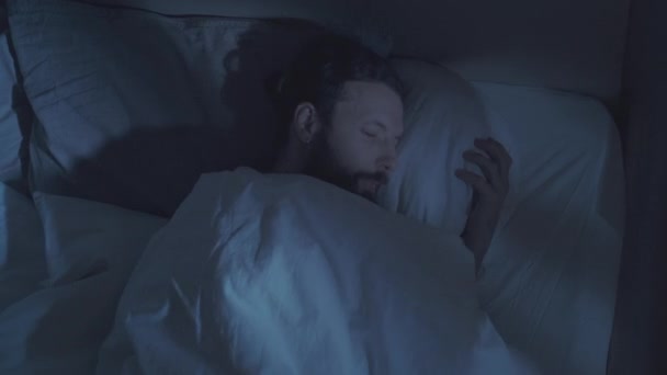bed fatigue night insomnia tired man lying in bed - Filmagem, Vídeo