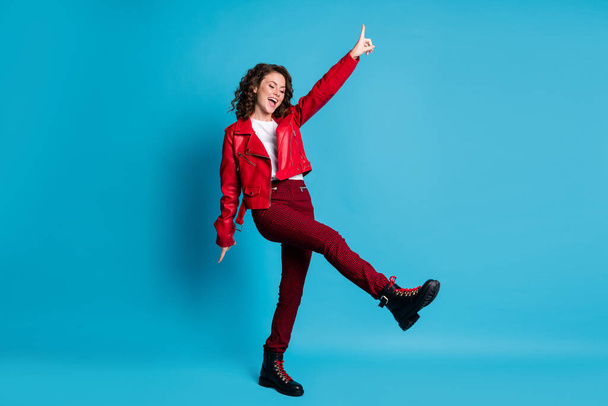 Full size photo of optimistic girl sing dance wear red jacket trousers shoes isolated on blue color background - Фото, зображення
