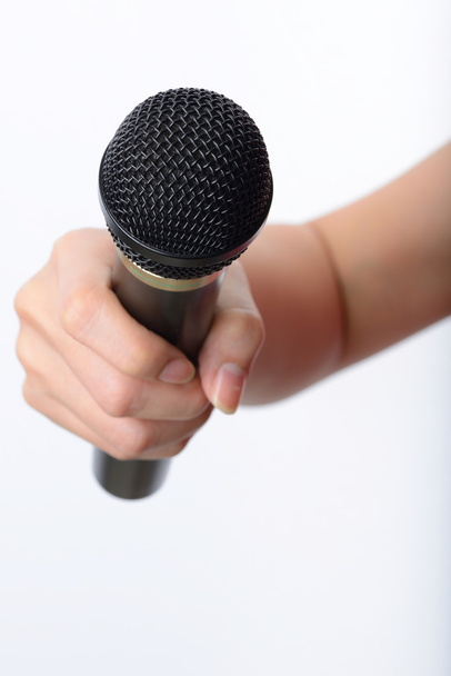 woman hand with microphone - Foto, afbeelding