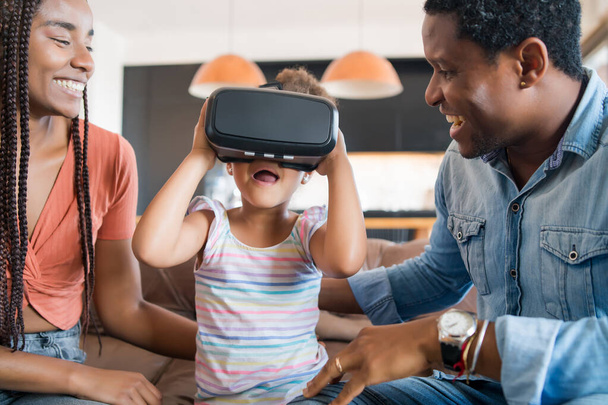 Family playing video games with VR glasses. - Fotoğraf, Görsel