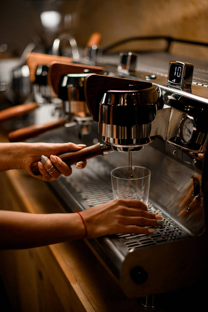 view of professional coffee machine with which barista prepares coffee - Foto, Bild