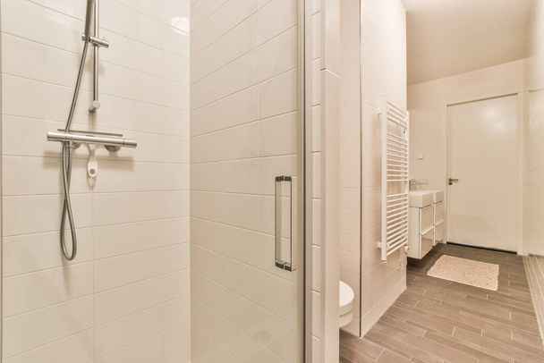 Shower cabin in modern washroom - 写真・画像