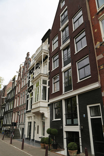 The characteristic buildings of the city of Amsterdam - Photo, Image