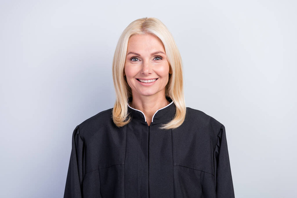 Portrait of attractive clever cheerful content skilled woman judge wearing black robe career isolated over grey pastel color background - Photo, Image