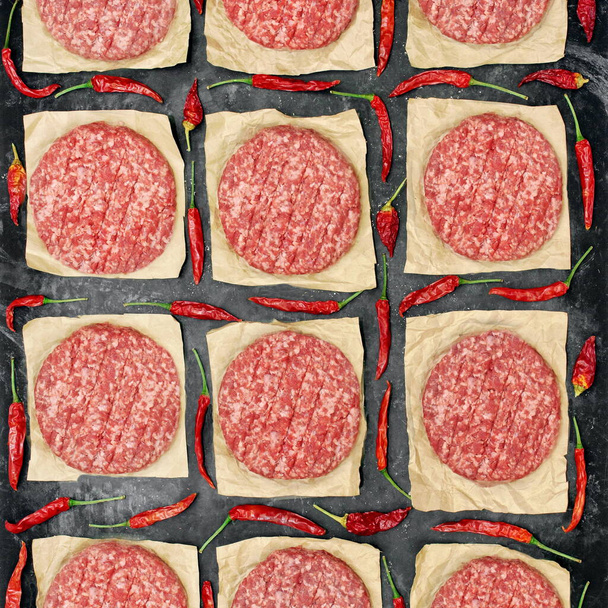 Many Raw Minced Steak Burgers from Beef Pork Meat on Black Background, Overhead View. Uncooked Ground Meat Patties for Grilling. Burgers for BBQ Grill and Grilling Tools, Top View. Abstract Pattern. - Photo, Image