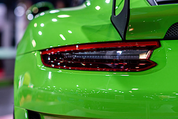 close-up of a red taillight on a luxury sport car, detail on the rear light of a car - Photo, image