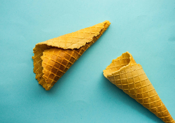 Sweet waffle cones as a summer background concept - Фото, изображение