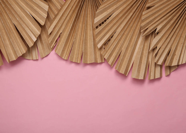 Decor dry palm leaves on pink background. Creative background. Copy space - Foto, immagini