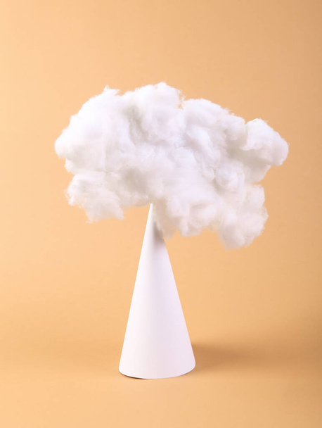 Floating fluffy cloud with cone on beige background . Creative idea. concept art. Minimalism - Zdjęcie, obraz
