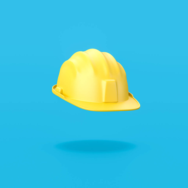 Yellow Hard Hat on Blue Background - Photo, Image