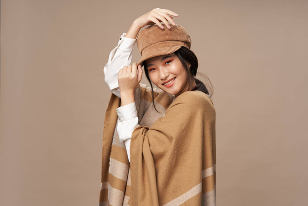cheerful asian woman fashionable clothing lifestyle beige background - Photo, Image