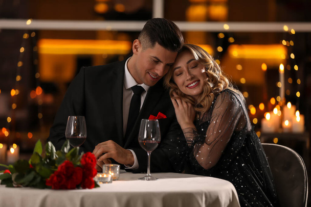 Lovely couple having romantic dinner on Valentine's day in restaurant - Foto, afbeelding