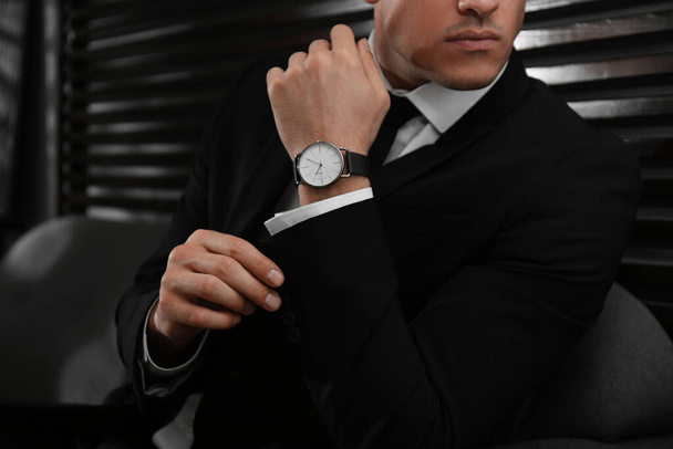 Businessman with luxury wrist watch indoors, closeup - Foto, Imagen