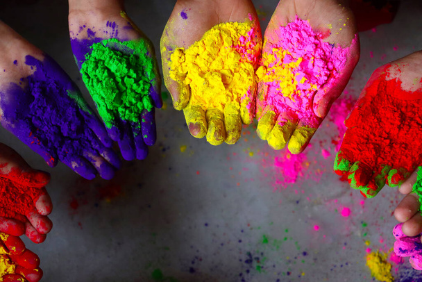 multiple colored powder on hands for holiday - Photo, Image