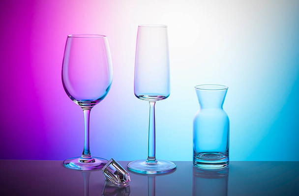 Glassware on a multicolored background - Photo, Image