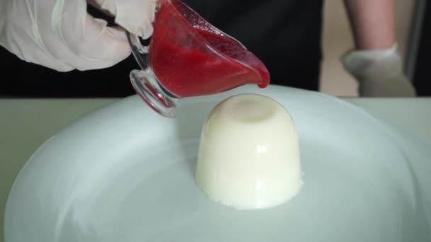 Cook watering pudding with red sauce - Footage, Video
