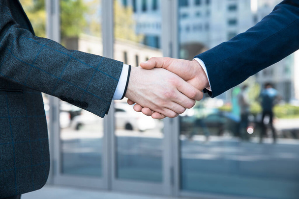 Handshake of business people in the office - 写真・画像