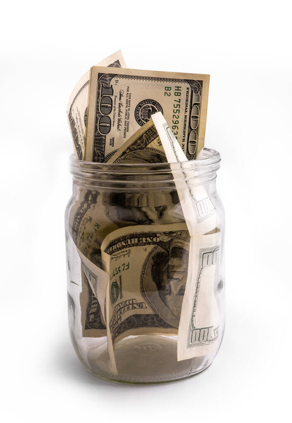 Conservare il denaro in vaso di vetro - risparmio di denaro concetto - Foto, immagini