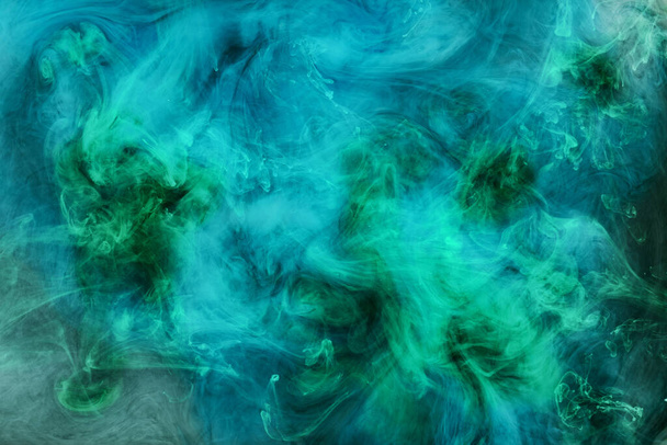 Abstract blue-green ocean, paint in water background. swirl of splashes and waves in motion. Fluid art wallpaper, liquid vibrant colors - Foto, imagen