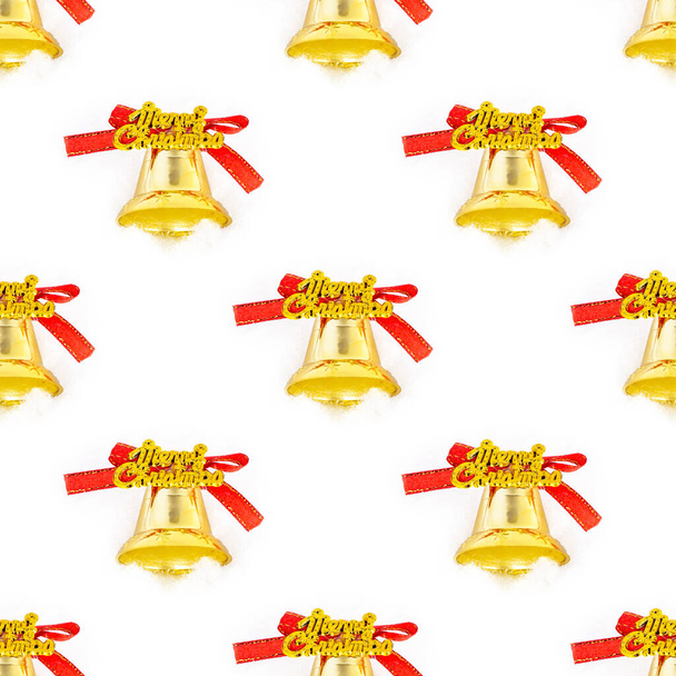 Bright golden Christmas decoration bell repeat seamless pattern on white background. Christmas and New Year traditional holiday celebration wrapping paper concept. - Photo, Image