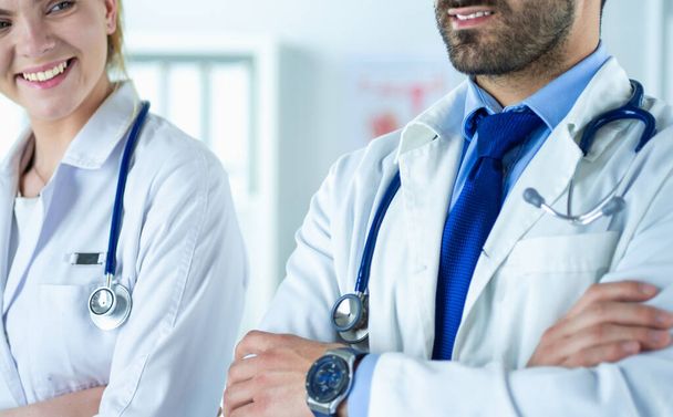 Portrait of confident doctors with arms crossed at medical office - Photo, image