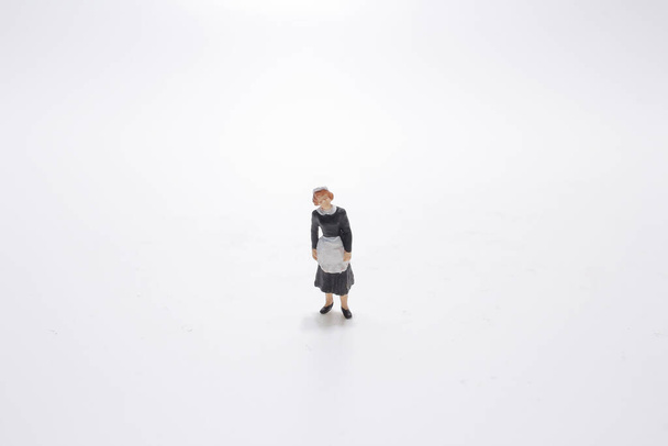 Miniature scale model  waitress on the wgite background - Foto, afbeelding