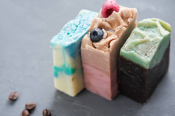 three bars of hand made organic soap for spa relax routine. exfoliating soap with various components for smoth and healthy body skin. - Photo, Image