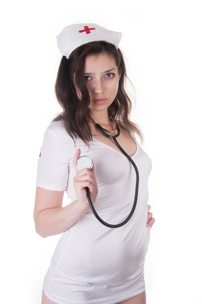 Lány szexuális stilizált ruha az egészségügyi nővér - Fotó, kép