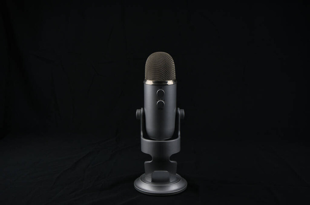 studio microphone for recording podcast on black background. object - Φωτογραφία, εικόνα