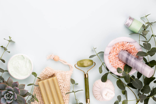 Spa and skin care homemade cosmetics. Bottles with spa cosmetic products on pastel background. - 写真・画像