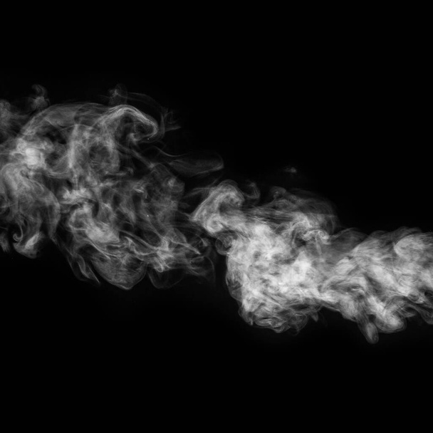 Horizontal curly white steam, fog or smoke isolated with transparent special effect on black background, square - Photo, image
