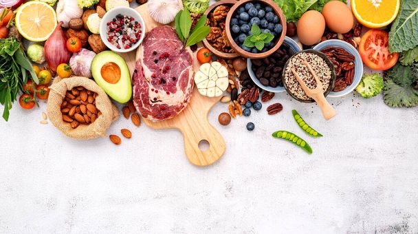 Ketogenic low carbs diet concept. Ingredients for healthy foods selection set up on white concrete background. - Photo, Image