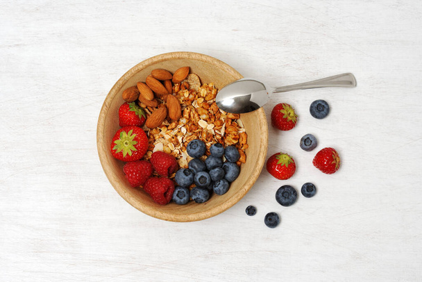 Bowl with fruits and cereals, flat lay - Foto, Imagen