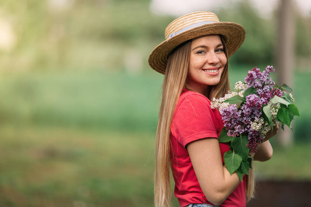 Beautiful young woman with makeup walks in the park, spring summer nature warm morning smile. - Foto, afbeelding
