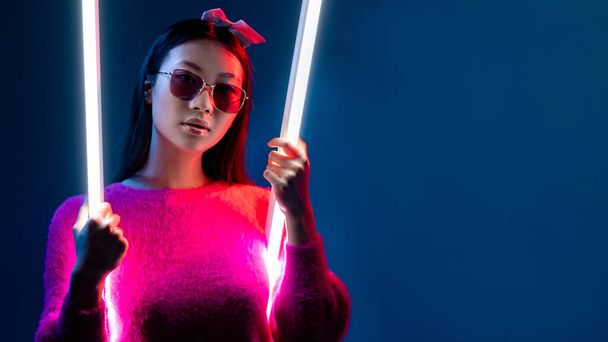 neon light beauty cyberpunk girl in glamour pink - Фото, изображение