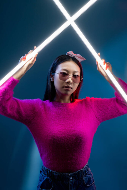 cyberpunk people neon light girl in glamour pink - Фото, изображение
