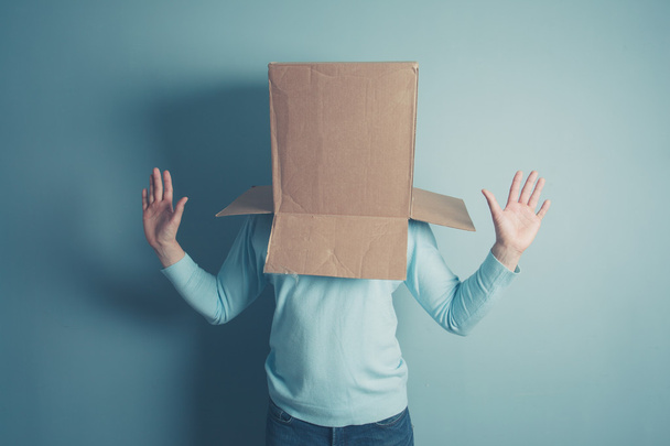 Shocked man with cardboard box on his head - Zdjęcie, obraz