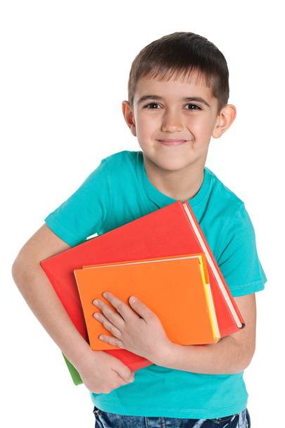 Cheerful young boy with books - Fotó, kép