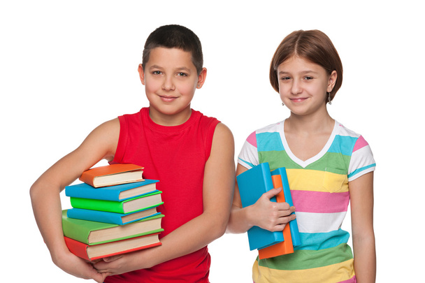 Preteen menino e menina com livros
 - Foto, Imagem