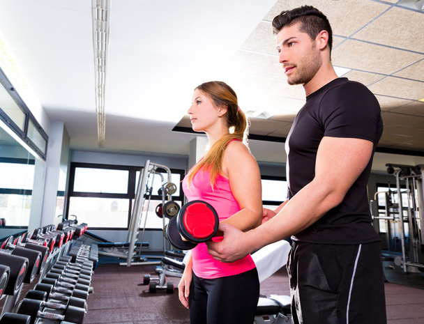Gym personal trainer man with dumbbell woman - Foto, Imagem