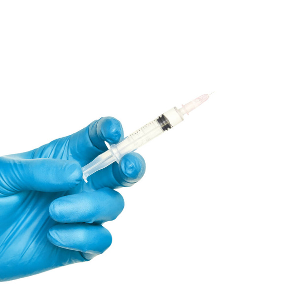 Person in blue glove hold vaccine bottle syringe. Injection pharmacy concept - Foto, Imagem