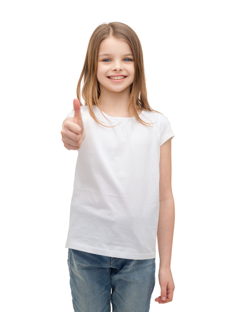 little girl in blank white tshirt showing thumbsup - 写真・画像