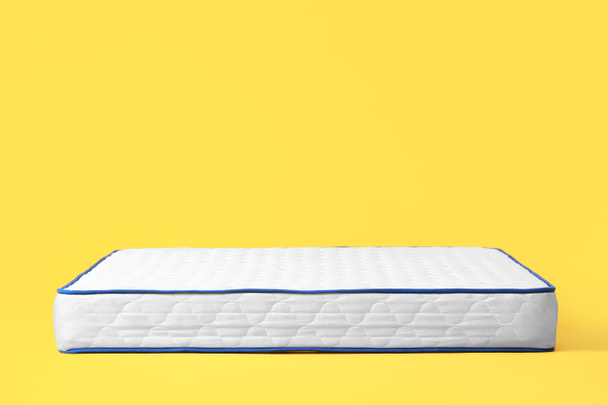Soft mattress on color background - Fotoğraf, Görsel