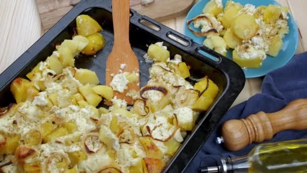 potato casserole with cheese Tasty, freshly prepared food on a baking sheet - Footage, Video